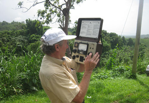 Lawrence Trumbower using a special meter while doing work for the radio station in Puerto Rico